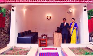 a man and a woman standing in a room at ShriGo Bekal Fort Resort & Spa in Bekal