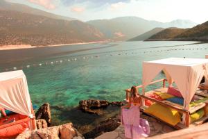 a view of a body of water with two beds at Club Hotel Barbarossa in Kas