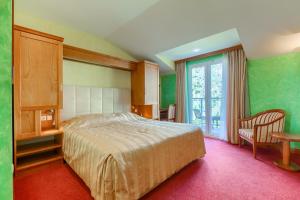 Voodi või voodid majutusasutuse Hotel Villa Dvor toas