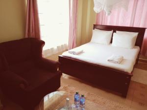 Postel nebo postele na pokoji v ubytování Crown Hotel Kericho