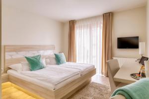 Postel nebo postele na pokoji v ubytování Hotel F-RITZ
