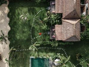 an overhead view of a yard with a swimming pool at Segara Lombok Beach Resort in Selong Belanak