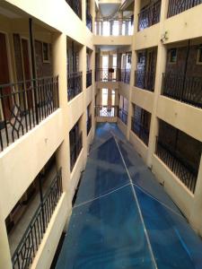 an empty hallway of an apartment building with a pool at Crown Hotel Kericho in Kericho +37 photos