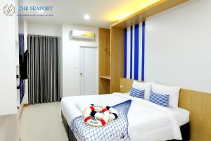 Postel nebo postele na pokoji v ubytování THE SEAPORT Hotel โรงแรมเดอะซีพอร์ต