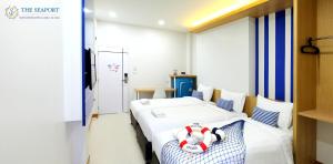Postel nebo postele na pokoji v ubytování THE SEAPORT Hotel โรงแรมเดอะซีพอร์ต