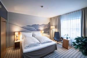 
En eller flere senger på et rom på Grand Hotel – by Classic Norway Hotels
