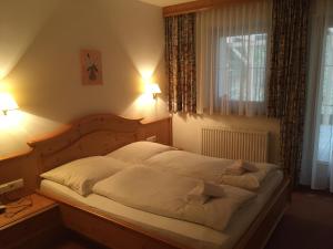 Postel nebo postele na pokoji v ubytování Landhaus Paradies Samnaun Spiss