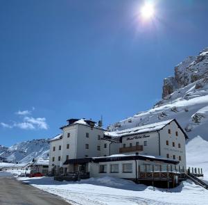 a large building with a ski lift on top of it at Hotel Col di Lana in Canazei