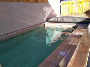 an overhead view of a swimming pool at La Lauze village house in Clarée Valley 4P in Val-des-Prés
