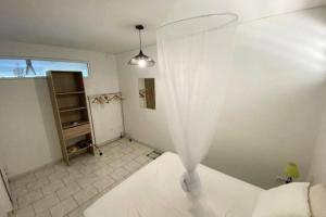 Ліжко або ліжка в номері Charmant appartement avec piscine