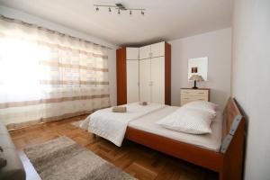 En eller flere senge i et værelse på Apartment Merica
