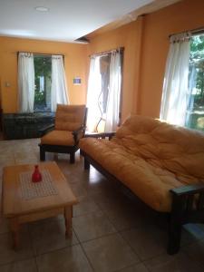 a living room with a couch and a coffee table at Rancho Apar T - in Tandil