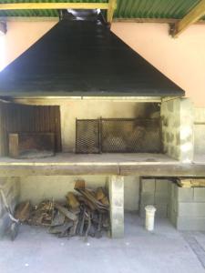 a table with a pile of wood in a building at Rancho Apar T - in Tandil