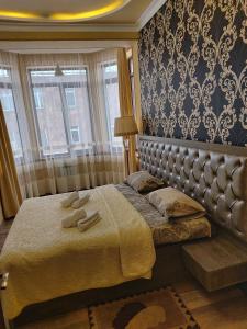 Postel nebo postele na pokoji v ubytování Hotel Felisa Gyumri