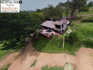 an aerial view of a house on top of a hill at Cavalo Guesthouse & Equestrian Estate in Drummond