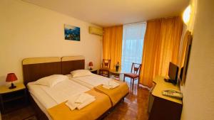 Postel nebo postele na pokoji v ubytování Hotel Cerna