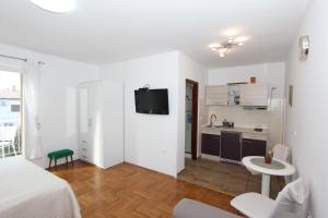 Televízia a/alebo spoločenská miestnosť v ubytovaní Apartment Gabriel