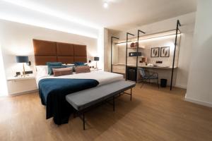 a large bedroom with a large bed and a desk at Hotel Taburiente S.C.Tenerife in Santa Cruz de Tenerife
