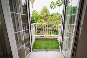 an open door to a balcony with green grass at Hotel Taburiente S.C.Tenerife in Santa Cruz de Tenerife