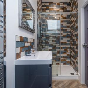 A bathroom at Luxury Loft Apartment by Bootique Wakefield