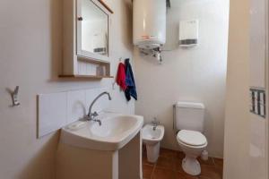 a bathroom with a sink and a toilet at Sunny 1-Bed apartment in lovely mountain village in La Brigue +42 photos