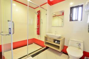 a bathroom with a toilet and a sink at Kenting Coral Sea Resort Hotel in Kenting +29 photos