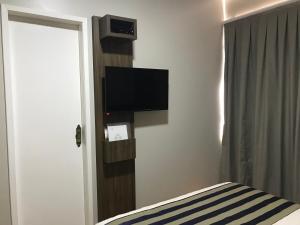 TV a/nebo společenská místnost v ubytování Hotel Requinte