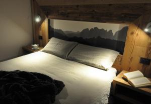 Postel nebo postele na pokoji v ubytování Albergo Alpino