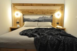 Postel nebo postele na pokoji v ubytování Albergo Alpino