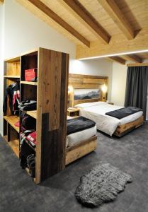 Postel nebo postele na pokoji v ubytování Albergo Alpino