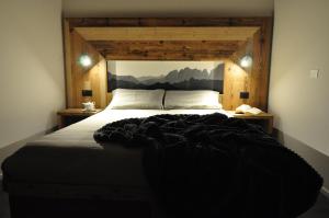 Postel nebo postele na pokoji v ubytování Albergo Alpino