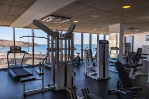 a gym with cardio equipment and a view of the ocean at R2 Bahia Playa - Adults Only in Tarajalejo