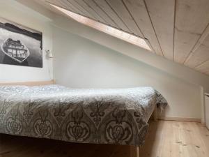 a bedroom with a bed in a room with a window at Apartamentai su terasa in Palanga +26 photos