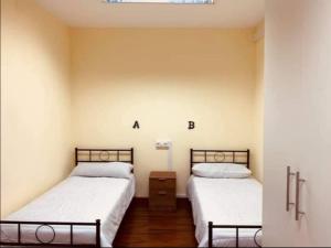 A bed or beds in a room at El cordal de laciana
