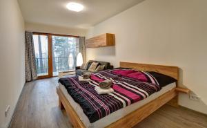 Łóżko lub łóżka w pokoju w obiekcie Apartmány Sunny Lipno
