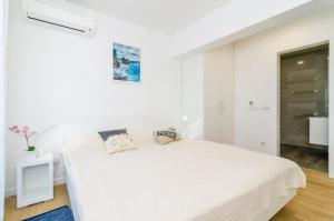 Postel nebo postele na pokoji v ubytování Apartment Lula