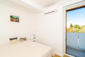 Postel nebo postele na pokoji v ubytování Apartment Lula