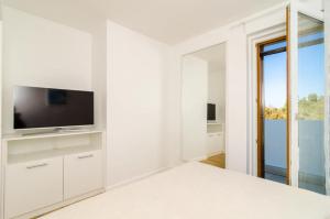 TV a/nebo společenská místnost v ubytování Apartment Lula
