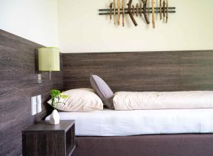Postel nebo postele na pokoji v ubytování eee Hotel Gunskirchen