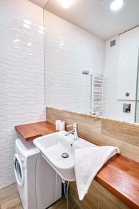 Posedenie v ubytovaní Apartament 26A Willa Ogrodowa