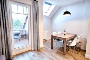Posedenie v ubytovaní Apartament 26A Willa Ogrodowa
