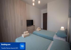 A bed or beds in a room at Msiebah Court San Gwann Modern Apt near Sliema and St Julians