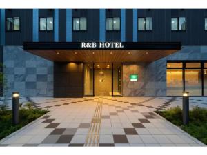 a hotel entrance with a checkered floor in front of a building at R&B Hotel Nagoya Shinkansenguchi - Vacation STAY 15002v in Nagoya