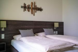 Postel nebo postele na pokoji v ubytování eee Hotel Gunskirchen