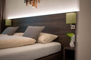 Postel nebo postele na pokoji v ubytování eee Hotel Gunskirchen
