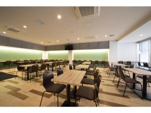 a dining room with tables and chairs in a building at R&B Hotel Hakata Ekimae 2 - Vacation STAY 16429v in Fukuoka