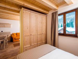 Un pat sau paturi într-o cameră la Borgo Fantino - Residenze e Alloggi Vacanza