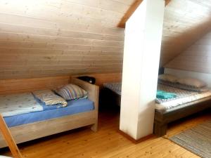 a room with two bunk beds in a cabin at Juba Holiday House in Võru