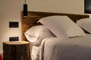 A bed or beds in a room at AFTER Hotel