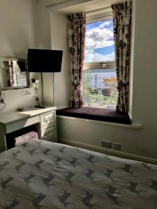Postel nebo postele na pokoji v ubytování Culag Lochside Self Catering